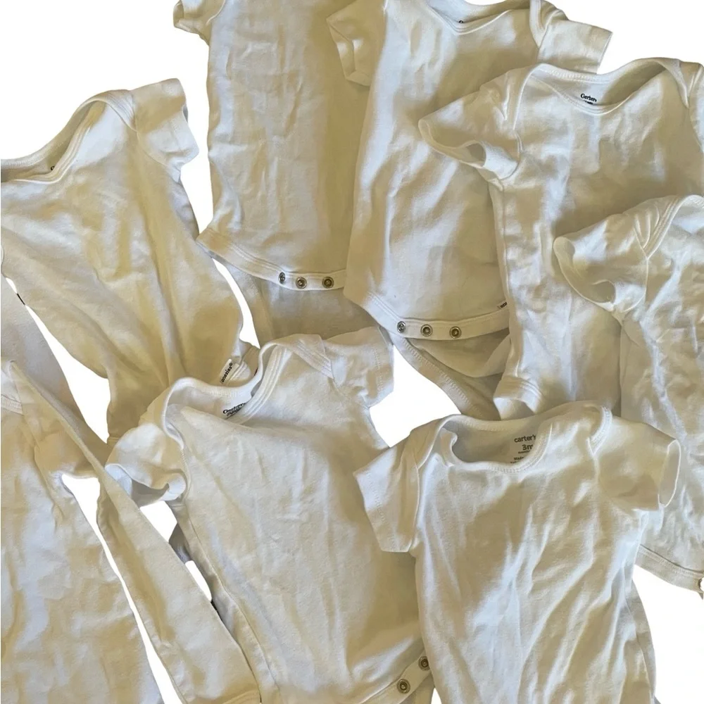 Bundle of 11 white onesies 3-6M